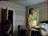 Blonde celebrity undresses in front of her mirror showing her  movie pretty tatas in this vintage clip.